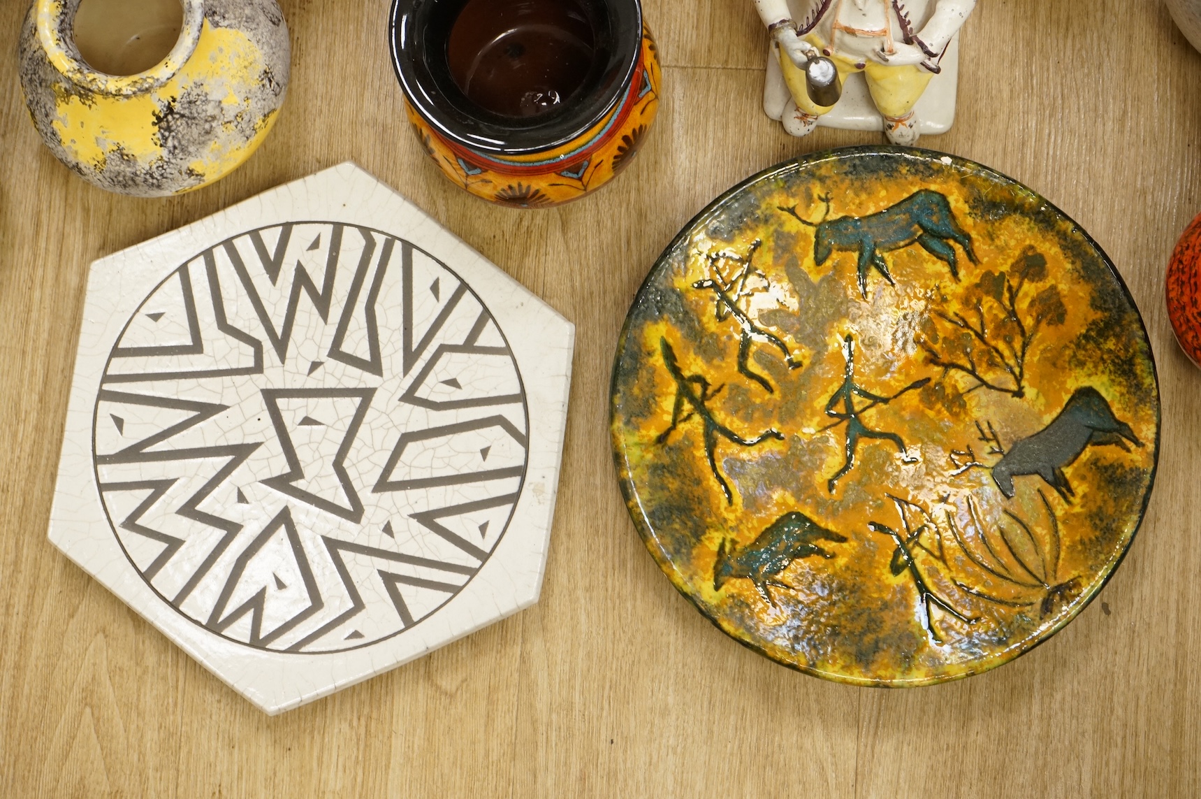 A collection of studio ceramics and pottery to include a Zsolnay vase and a Lyn Alves hexagonal dish